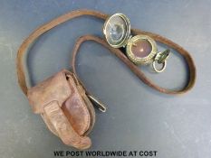 A Negretti and Zambra marching compass in leather pouch