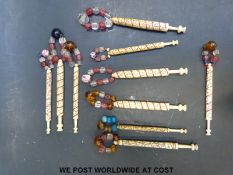 Ten 19thC carved bone spiral carved love tokens / marriage bobbins in the James Compton style