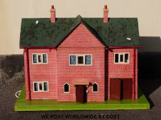 A home built doll's house with electric lights and switches and two opening sides