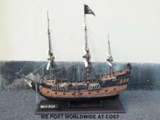 A scratch/ kit built model of The Pirates of the Caribbean's 'Black Pearl' pirate ship with four