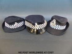 Three Elizabeth II policewomen's hats or caps to include Metropolitan,