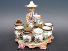 A Bayeux Langlois faience desk tidy formed as an oriental spice seller (height 15cm)