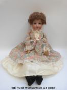 Alt, Beck & Gottschalk (ABG) bisque headed doll with open mouth, weighted blue eyes,