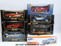 Seven Burago and Maisto 1:18 scale diecast model vehicles,
