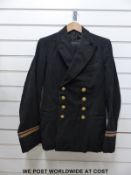 A c1950 Merchant Navy uniform comprising jacket and trousers labelled E J Whittaker, Chatham,