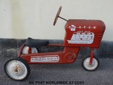 GGG Powerama Garton tin-plate chain drive pedal tractor in red with white logos, 90cm long.