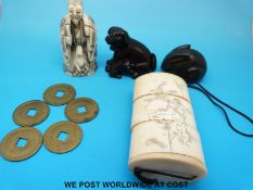 A bone netsuke of a scribe, two wooden netsukes,