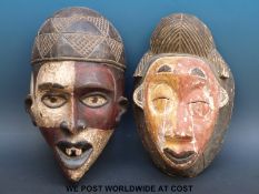 Two African tribal masks with painted decoration (largest 36cm)