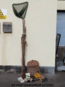 A collection of fishing tackle to include a fisherman's creel, a landing net,