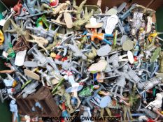A large quantity of Britains and other lead and plastic soldiers, cowboys and Indians.