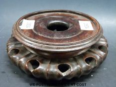 An 18thC Chinese wooden stand (diameter 19cm)