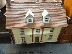 A large doll's house and furnishings