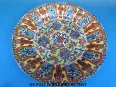 A 19thC Chinese clobbered plate (diameter 29cm)