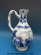 An 18th/19thC Chinese blue and white jug with landscape and figural decoration (21cm tall)