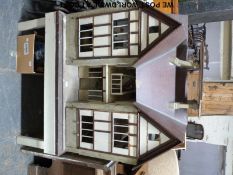 A very large doll's house on stand with some original furnishings