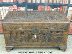 An Eastern carved camphor wood chest (H54cm x L94cm x W44cm)