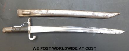 An Austrian yataghan 1867 or 1870 pattern bayonet and scabbard, GF to blade, 16, 106, LR to quillon,