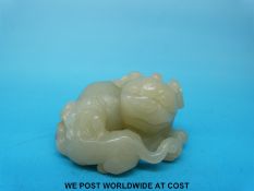 A Chinese carved jadeite model of foo dogs