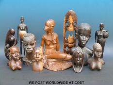 A group of carved wooden African figures and a clay bust