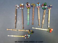 Ten 19thC carved bobbins including bone