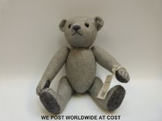 Steiff Original Teddy Bear No. 437 in grey felt, with certificate, 32cm tall.