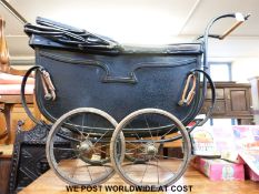 A Victorian/Edwardian 'Limousette Baby Coach' doll's pram with fitted interior and fold up hood