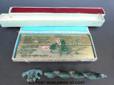 A collection of Chinese painting paper weights, including ducks,