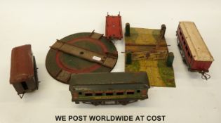 A quantity of Hornby 0 gauge track, carriages, turntable etc.