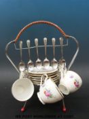 A retro bone china tea set on metal stand with teaspoons