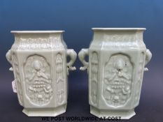 A pair of 19thC Chinese celadon vases with moulded decoration of Guanyin sitting on a lotus leaf