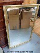 A bevelled edge mirror in gilt frame (49 x 59cm)