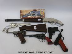 Seven Lone Star, Crescent and other replica revolvers, pistols and a rifle,