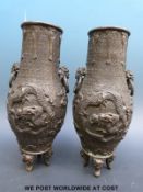 A pair of 19thC Chinese bronze vases with dragon decoration and seal mark to base (25cm tall)