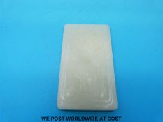 A Chinese jade pendant carved with figural decoration and calligraphy (6.