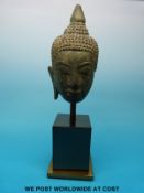 A post Khmer bronze buddha head on mounted base