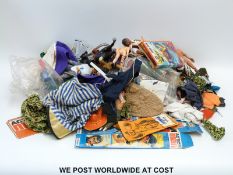 A large collection of Action Man and similar action figures and accessories