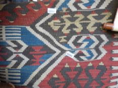 A 19th/20thC Turkoman rug on a predominately red ground