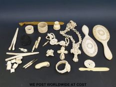 A large collection of European carved ivory and bone including a deeply carved crucifix decorated