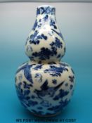 A Chinese blue and white double gourd vase with bird and insect decoration,