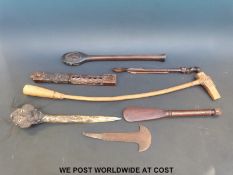 A group of African tribal weapons and implements