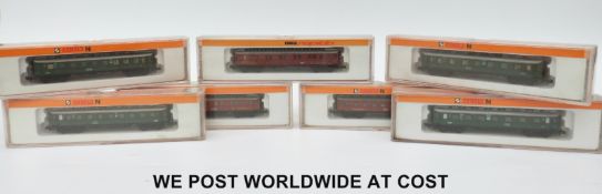 Seven Arnold N gauge carriages,