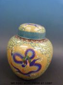 A Chinese cloisonne ginger jar with dragon decoration on a yellow ground (26cm tall)