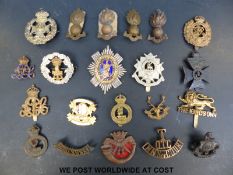 A quantity of military cap and other badges to include King's Own, Prince of Wales Own Yorkshire,