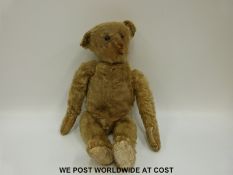 Steiff mohair bear with cocked feet and wrists, jointed limbs and pointed snout,
