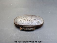 Japanese Edo period kashira or pommel engraved with flowers.