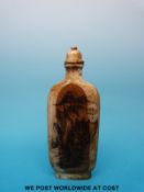 A Chinese ivory snuff bottle with carved landscape scene and calligraphy to back