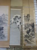Two Japanese scroll paintings, one depicting a tree branch, the other a river and mountain scene,