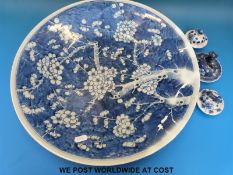 A large 19thC Chinese charger with prunus decoration and three blue and white lids (41cm diameter)