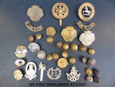 A quantity of Lancashire military badges etc.