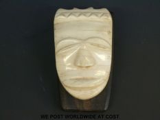 An 18th/19thC ivory African carved ivory mask